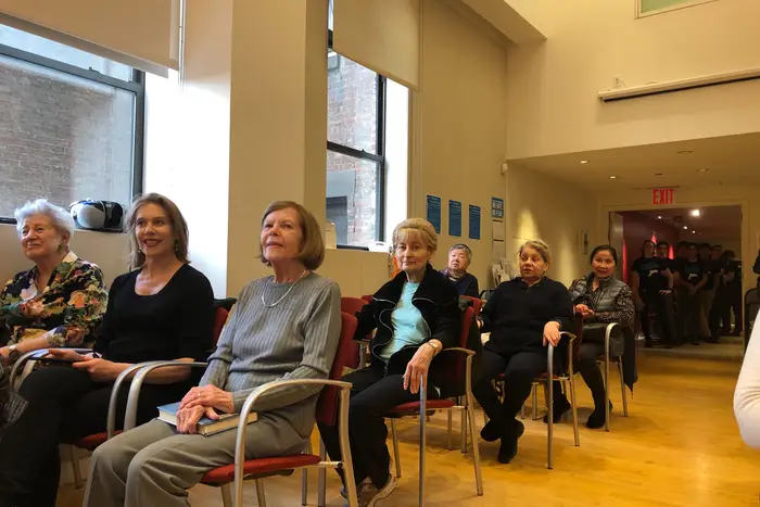 Senior citizens sit in chairs at the Dorot Center on Wednesday, March 11, 2020.